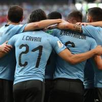 Uruguay 3 Russia 0: Reality check for the Russians as Suarez & Cavani goal seal Group A top spot